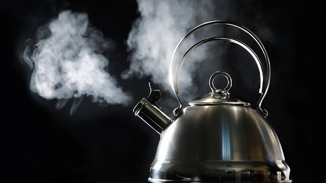 Teapot with boiling water